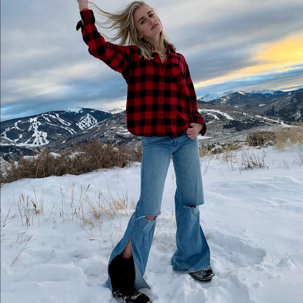 Flare jeans ripped knees and slits up sides